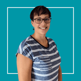 Teal background with white square outline with image of Kate Pearson, wearing a grey and white stripey t-shirt with glasses on, smiling at the camera.