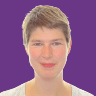 Professional headshot of Gudran Stolzenburg with short light brown hair, wearing a light-coloured top, against a purple background.