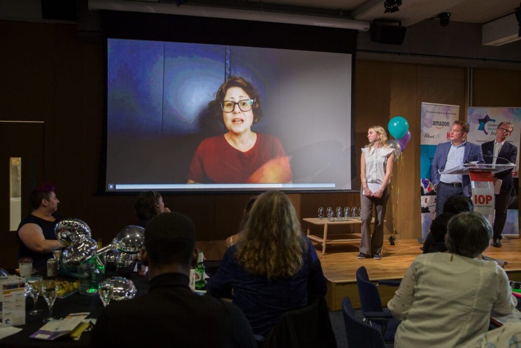 Becca Lory Hector's video playing on screen at the CND Awards