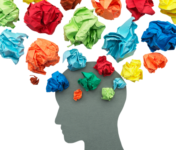 Silhouette of a head with scrunched up multi-coloured paper surrounding it