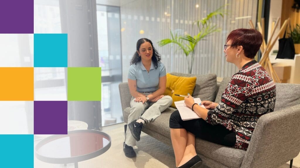 photo of two workers talking informally