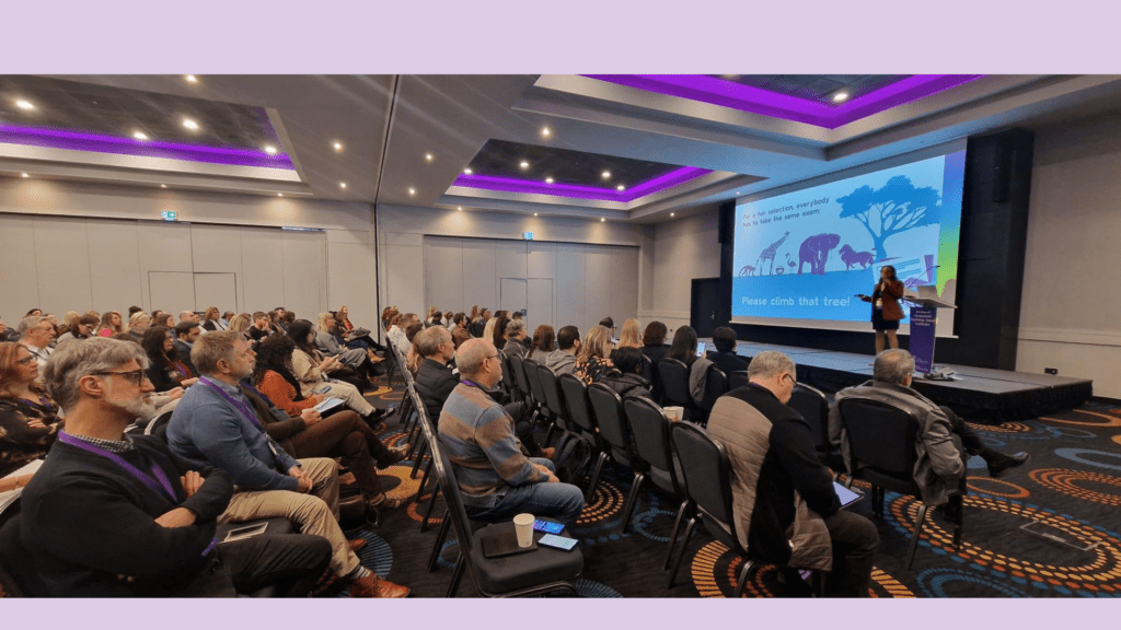 Image of Nancy Doyle giving her key note speech to a buy crowd at the DOP Conference 2025
