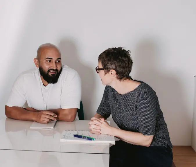 Fiona and Mo from Genius Within having a 121 chat