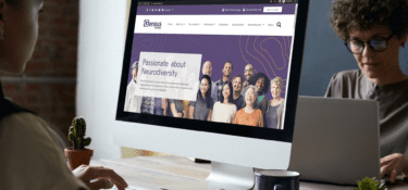 two people using screens, looking at genius within website