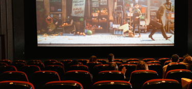photo of a cinema with animated movie showing