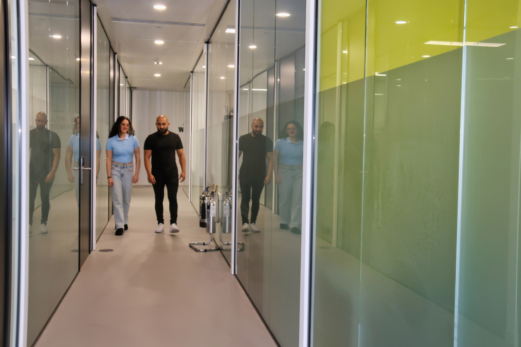 two people walking in corridor