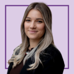 Head-and-shoulders portrait of Courtney Avery smiling with long, centre-parted blonde hair with darker roots, wearing a black blazer over a dark top and a silver necklace. They are looking at the camera against a light purple background with a dark purple square outline behind them.
